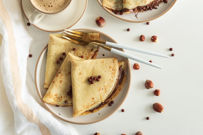Crepes with Nutella, strawberries and hazelnuts
